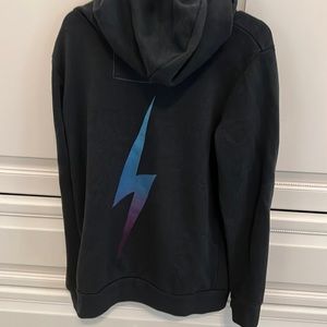 AV Nation navy blue zip-up hoodie with aqua and purple thunderbolt.